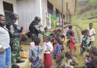 Satgas Yonif 511/DY Bagikan Alat Tulis untuk Anak-Anak di Kampung Popome